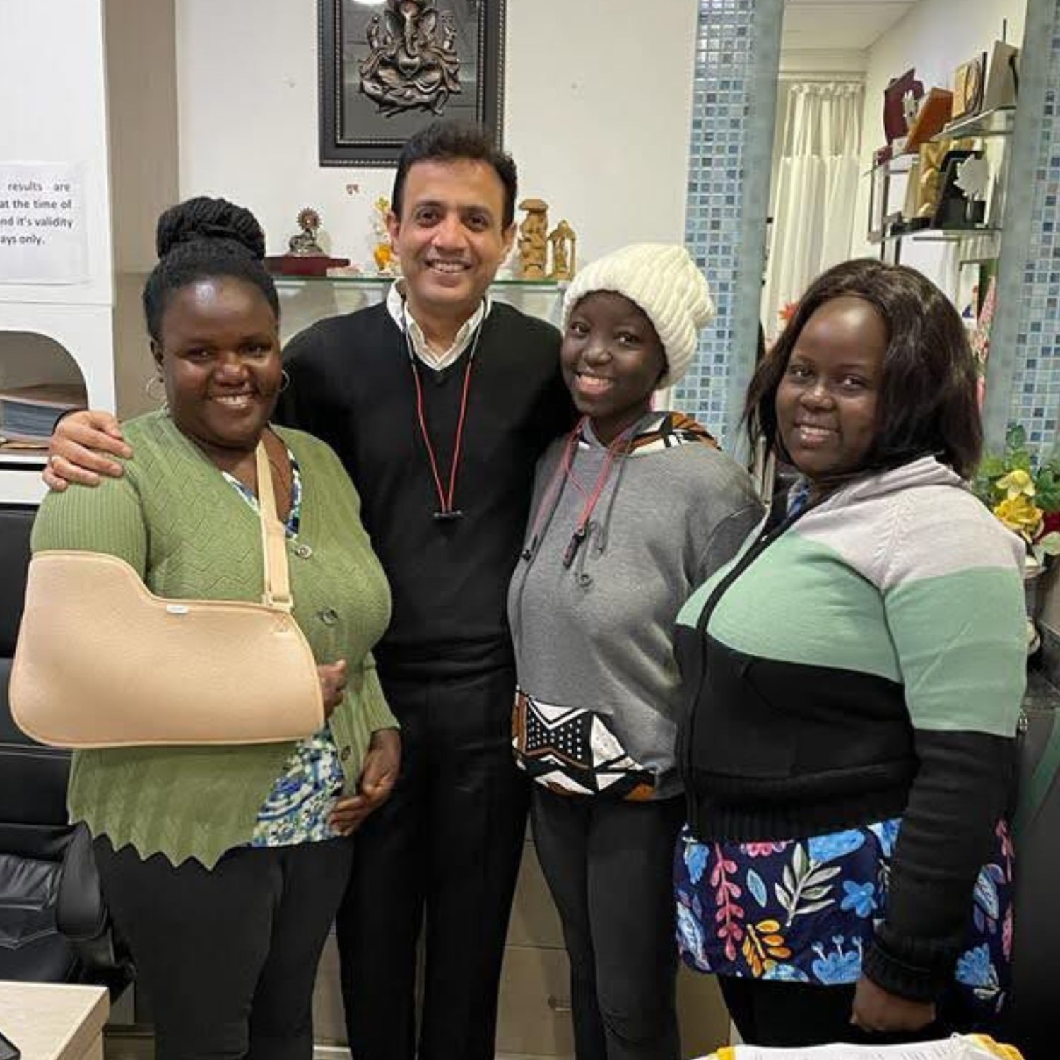 cancer survivor with family and doctor