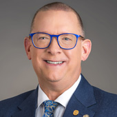 Headshot photo of International President, Mark S. Lyon